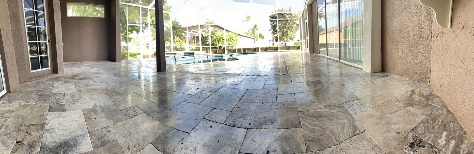 Travertine pool deck restored and sealed in Tampa